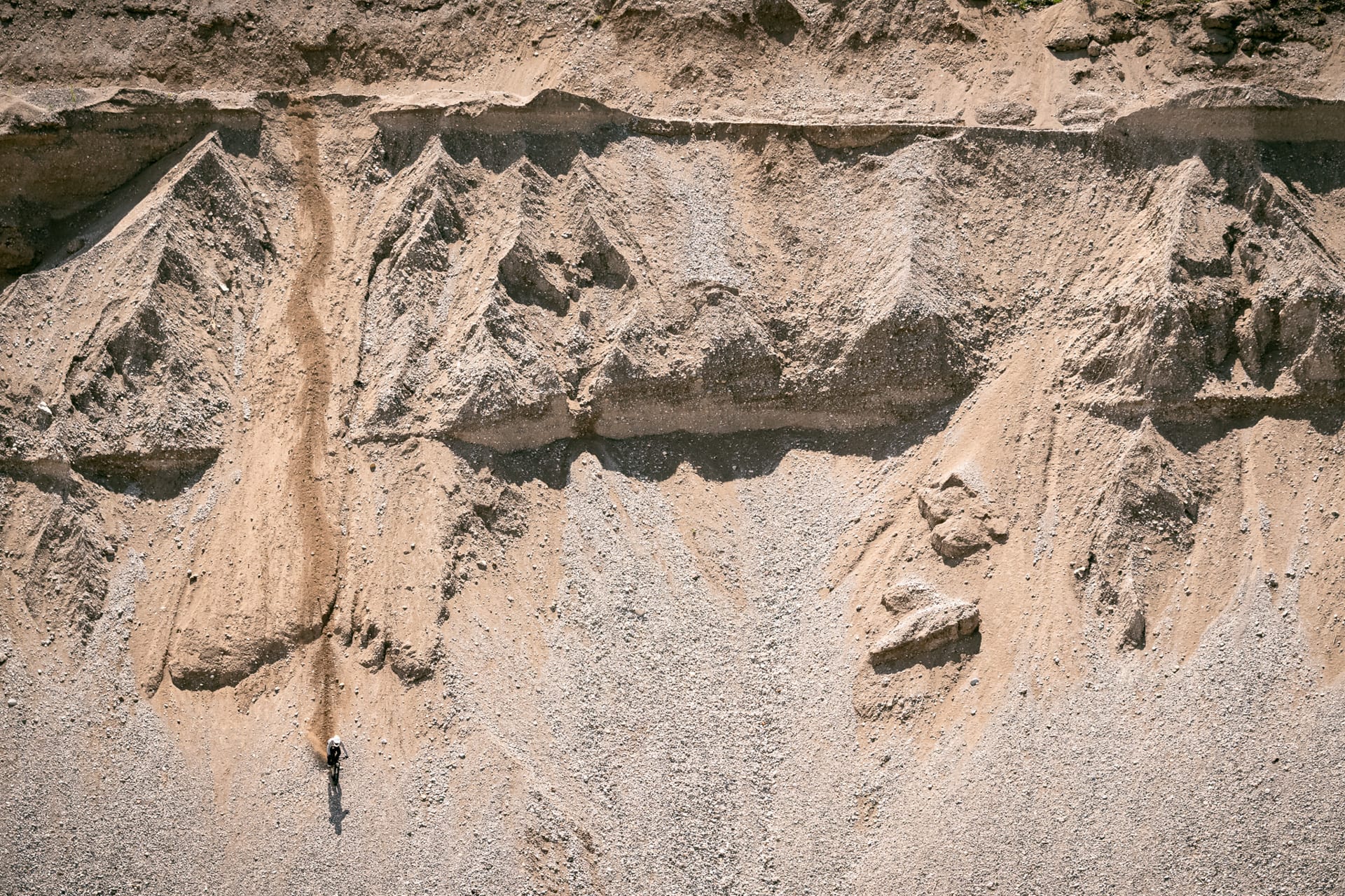 BineZalohar@KeepBusybyLegitFilms©KatjaPokorn Mountain biker riding a line down the sand pit