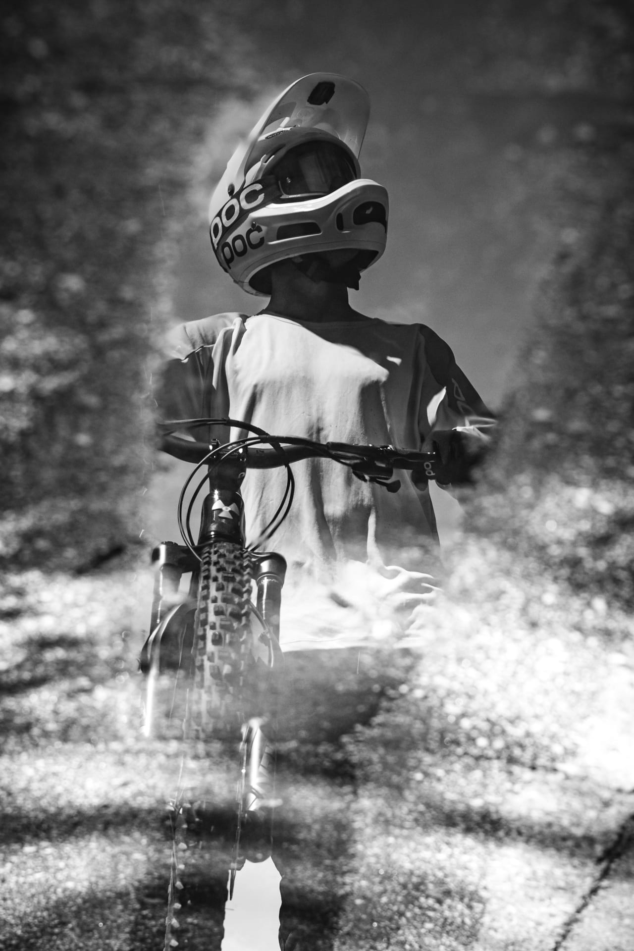 BineZalohar@KeepBusybyLegitFilms©KatjaPokorn Portrait shot of a biker in puddle reflection